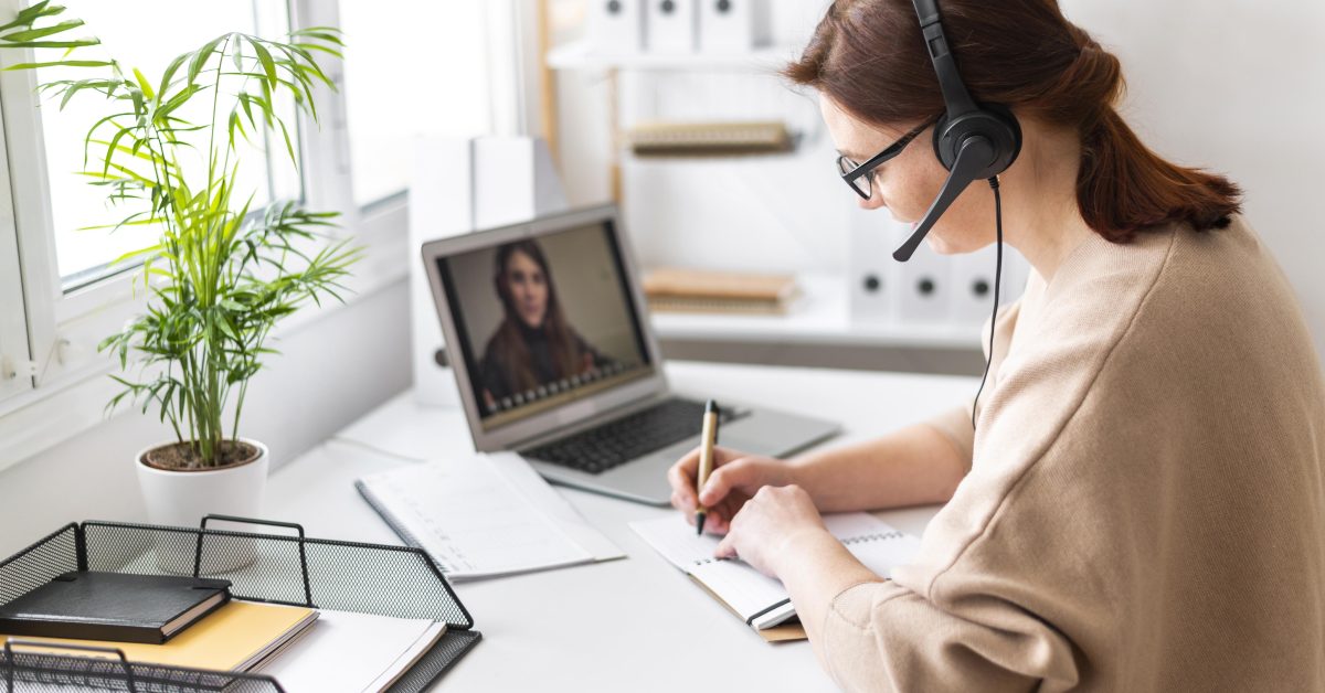 portrait-woman-work-having-video-call-laptop