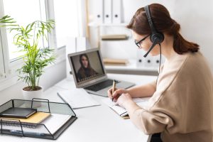 portrait-woman-work-having-video-call-laptop